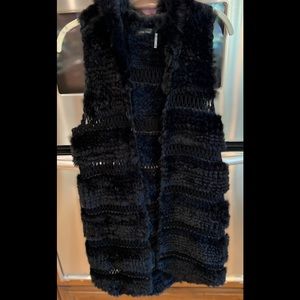 Black real rabbit fur long vest with hood and 5 hook and eye front closure.